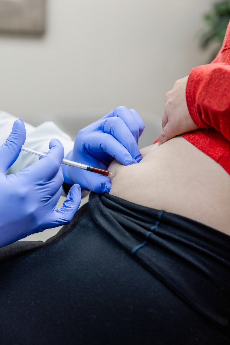 Clinician giving a subcutaneous injection